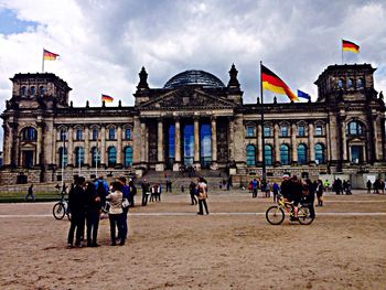 Tourists in front of building