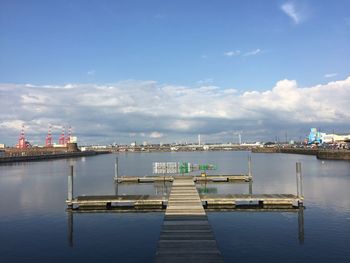 Pier at harbor against sky