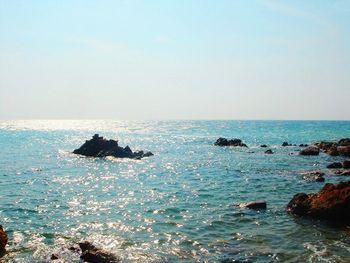 Scenic view of sea against blue sky