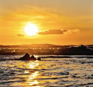 Scenic view of sea against sky during sunset