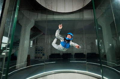 A woman flies in a wind tunnel. free fall simulator