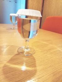 Close-up of wine glasses on table