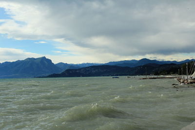 Scenic view of mountains against cloudy sky