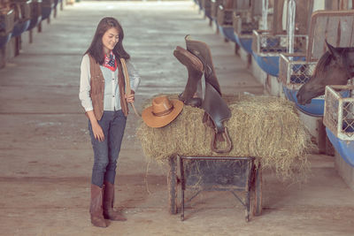 Portrait of young woman with horse