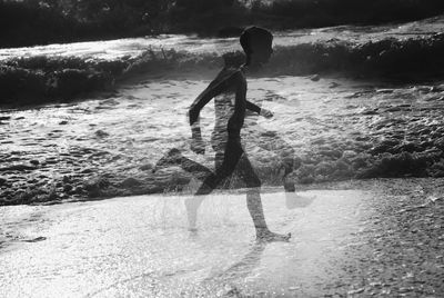 Multiple image of boy running at beach