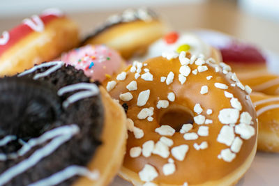 Close-up of various donuts desserts on a plate 