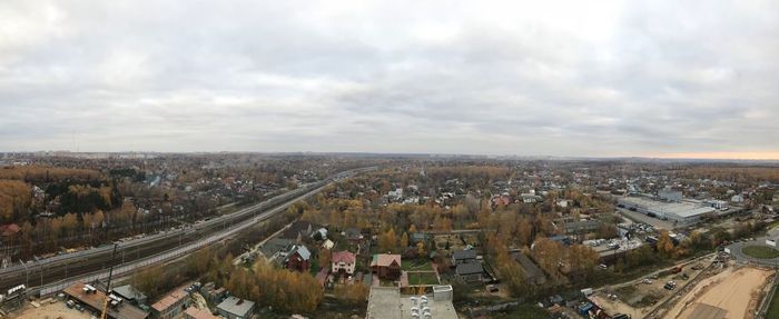 High angle view of vehicles on road amidst buildings in city