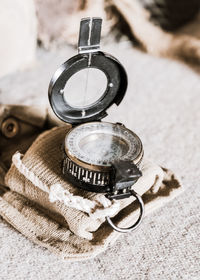 Close-up of navigational compass on table