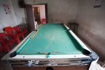 High angle view of messy table in abandoned building