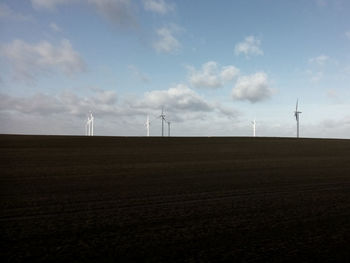Wind turbines on field