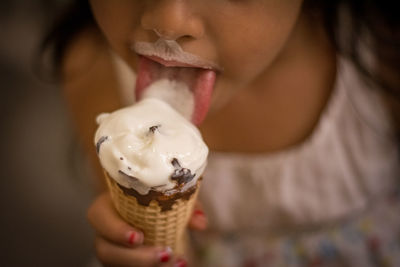 Close-up of woman holding ice cream