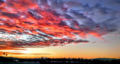 Scenic view of dramatic sky at sunset