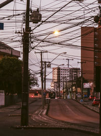 Trees in city against sky