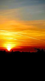 Scenic view of dramatic sky during sunset