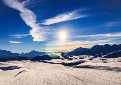 Scenic view of snowcapped mountains against sky