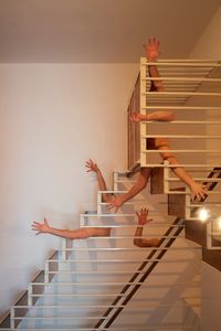 Low section of woman on staircase at home