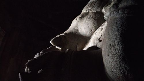 Close-up of statue against black background