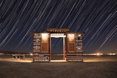 Light trails on the beach at night