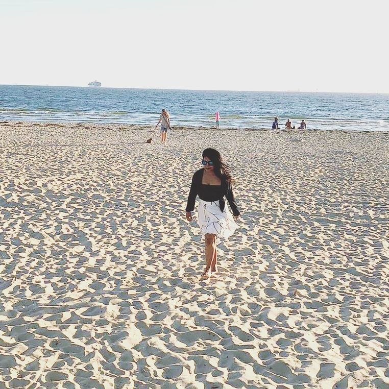 beach, sea, sand, horizon over water, full length, shore, rear view, vacations, scenics, nature, real people, tranquility, one person, water, day, outdoors, standing, clear sky, childhood, lifestyles, sky, beauty in nature, young adult, adult, people, adults only