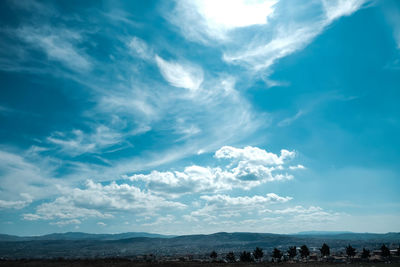 Scenic view of landscape against cloudy sky