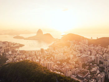 High angle view of city against sky during sunset