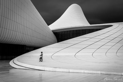 Midsection of man walking in city