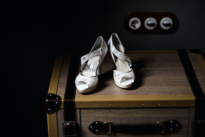 Close-up of high heels on table