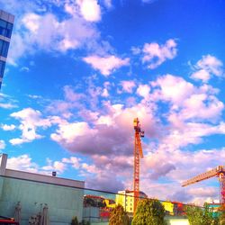 Low angle view of building against cloudy sky