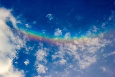 Low angle view of rainbow in sky