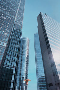 Low angle view of modern buildings against sky