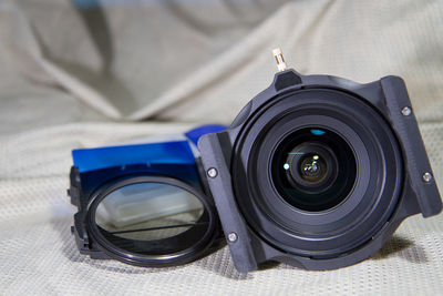 Close-up of camera on bed 