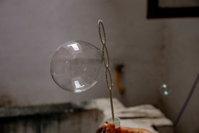 Close-up of hand holding bubbles