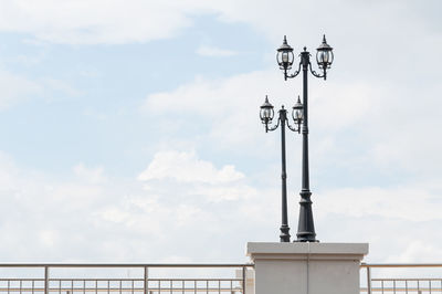 Low angle view of communications tower against sky