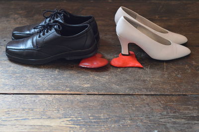 High angle view of shoes on wooden table