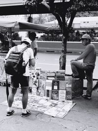 Rear view of woman standing in city