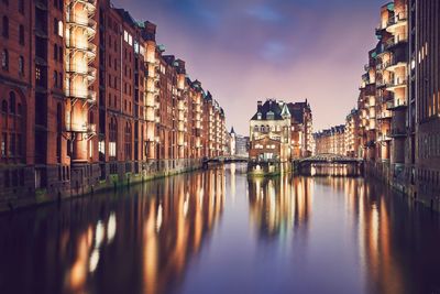 Canal amidst buildings in city