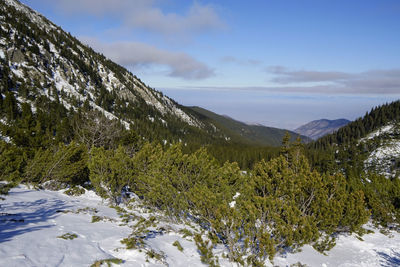 Scenic view of mountains against sky during winter