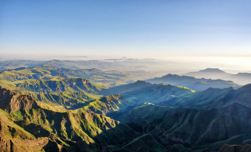 Scenic view of dramatic landscape against sky during sunset