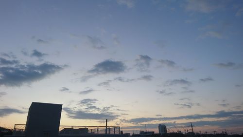 Low angle view of silhouette buildings against sky during sunset