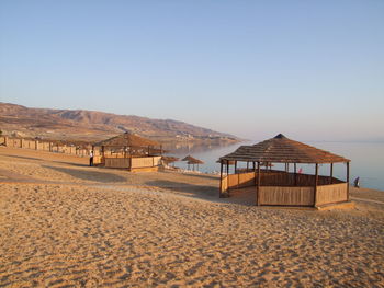 Scenic view of beach against clear sky