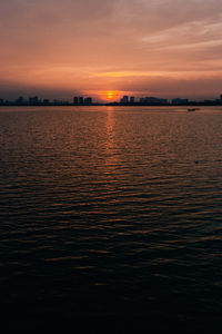 Scenic view of sea against romantic sky at sunset