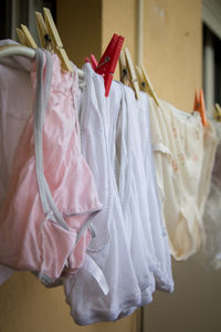 Close-up of clothes drying on clothesline at home