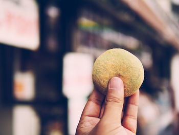 Close-up of hand holding food