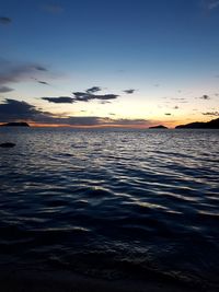 Scenic view of sea against sky at sunset