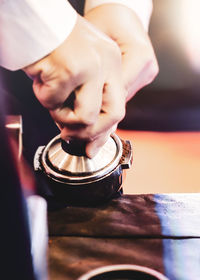 Close-up of man working on metal