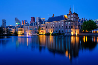 Reflection of illuminated buildings in water