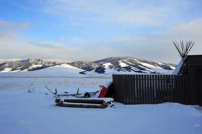 Scenic view of snow covered mountains against sky