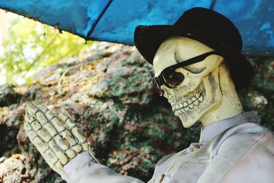 Close-up of sculpture with hat and sunglasses