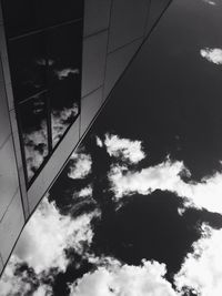 Low angle view of building against cloudy sky