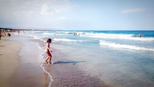 People walking on beach